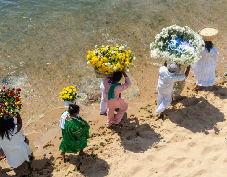 Salvador, Bahia, Brazil - February 17, 2019: Members of Candomble are seen bringing gifts to Iemanja on Rio Vermelho beach in the city of Salvador, Bahia.